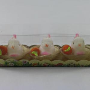 Easter bunny with carrot in nest