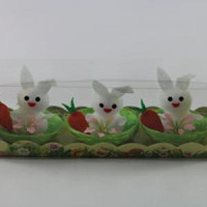 Easter bunny with carrot in nest