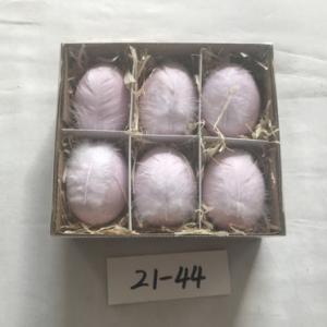 Easter chick egg colored with crack and white feather 21-44/45