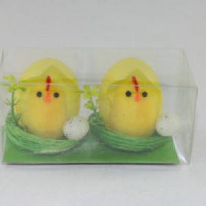 Easter chick in egg with small egg in nest