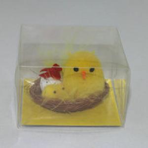 Easter chick with egg and small chick in nest