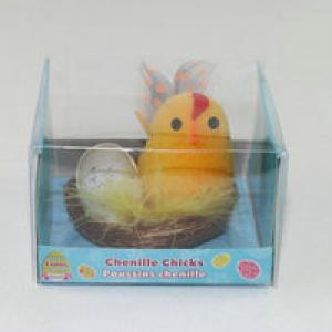 Easter chick with tail, egg and small chick in nest 