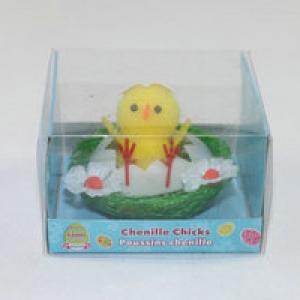 Easter pom pom chick with egg and flower in nest